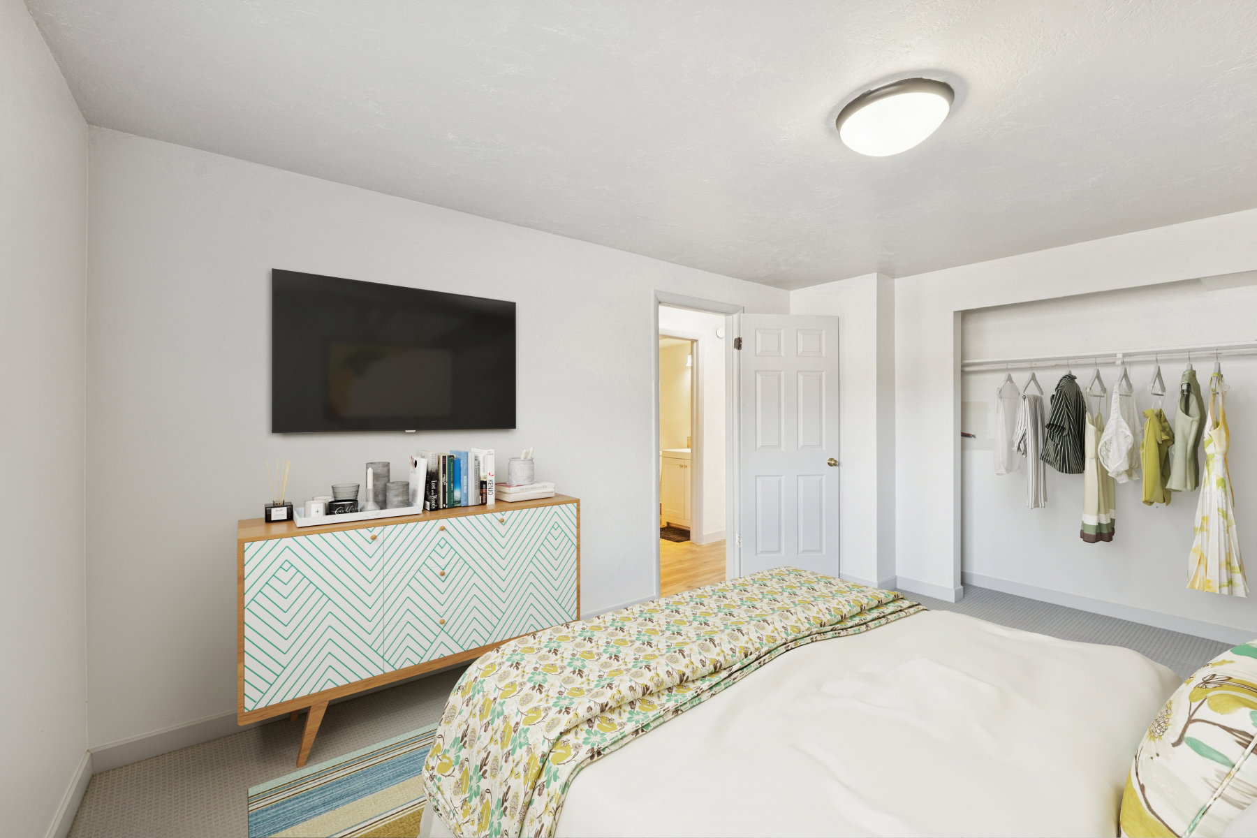 Bedroom featuring light gray carpeting, neutral wall finishes, and a flush-mount ceiling light