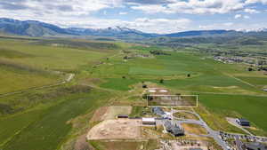 Expansive land parcel featuring open fields and distant mountains