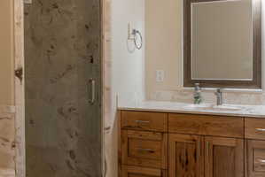 Shower enclosure featuring patterned frosted glass and chrome hardware