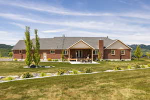 Expansive brick exterior with a dark shingle roof and white soffit