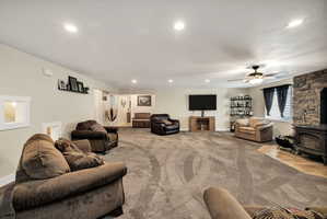 Expansive interior space featuring recessed lighting and a ceiling fan