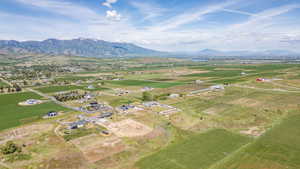 Expansive land parcel featuring open fields and distant mountain ranges