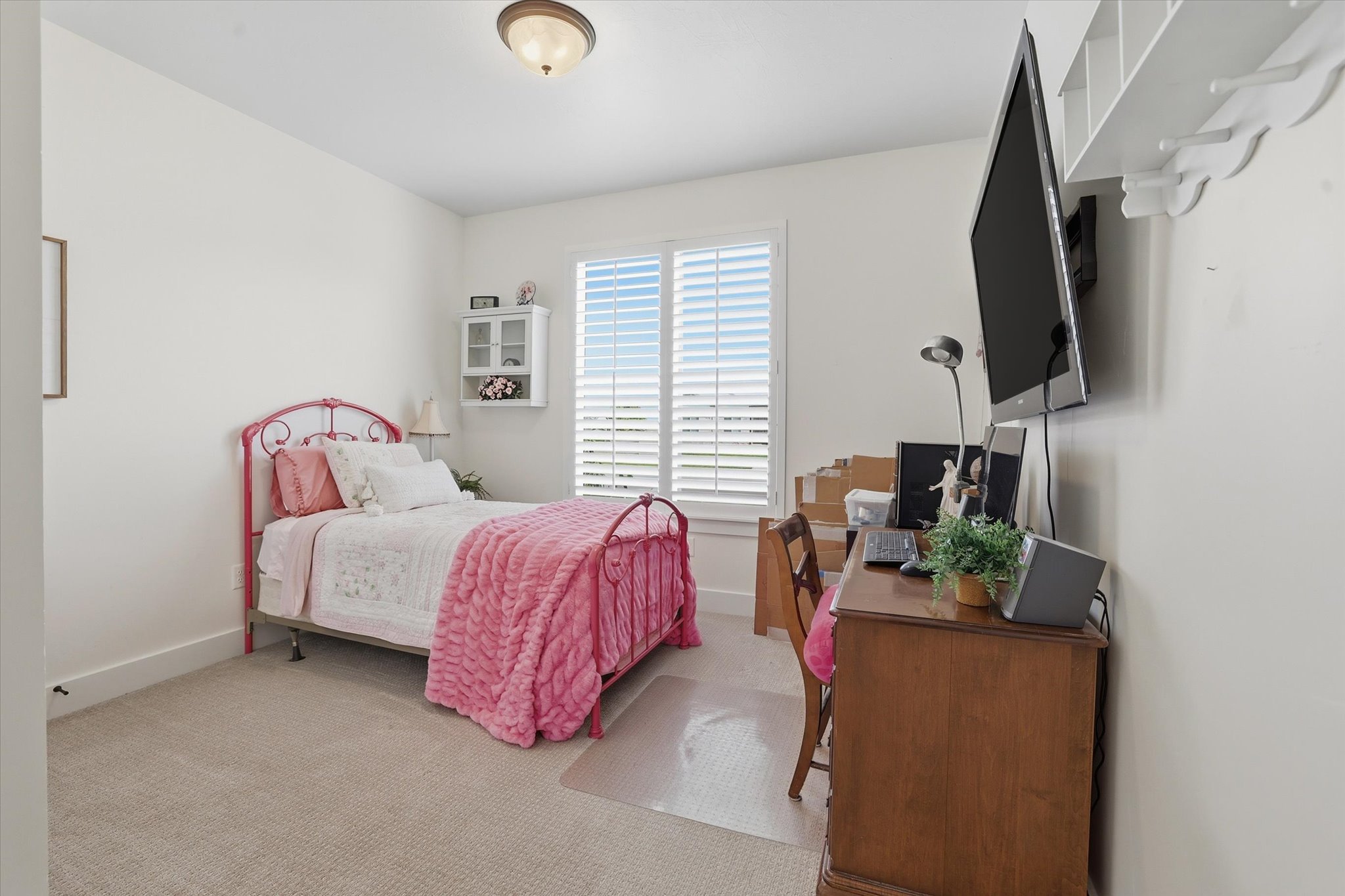 Bedroom featuring neutral wall paint and carpet flooring