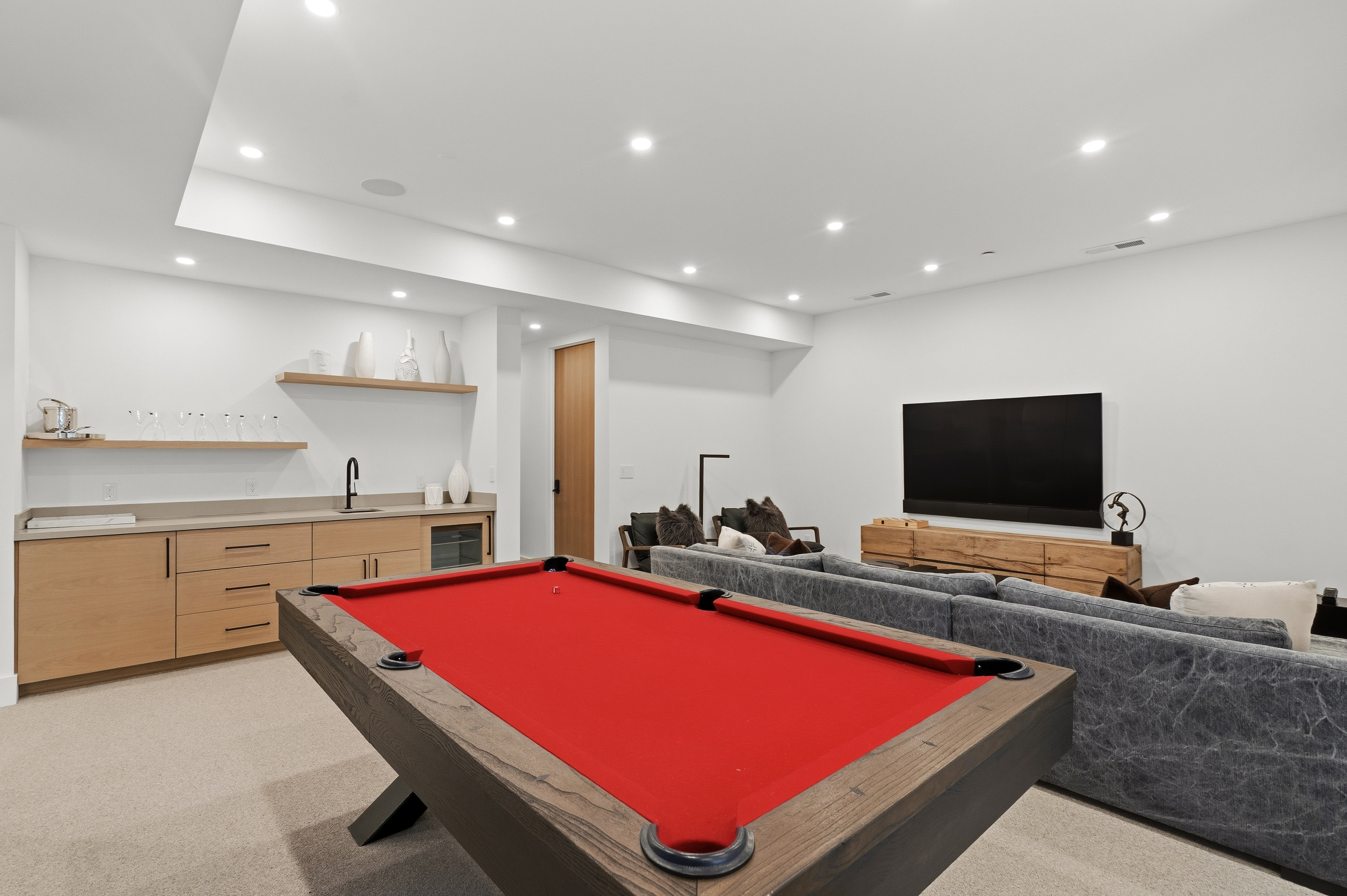 Entertainment room featuring pool table, sitting area, recessed lighting, and wet bar