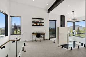 Open loft space with soaring ceilings and expansive windows