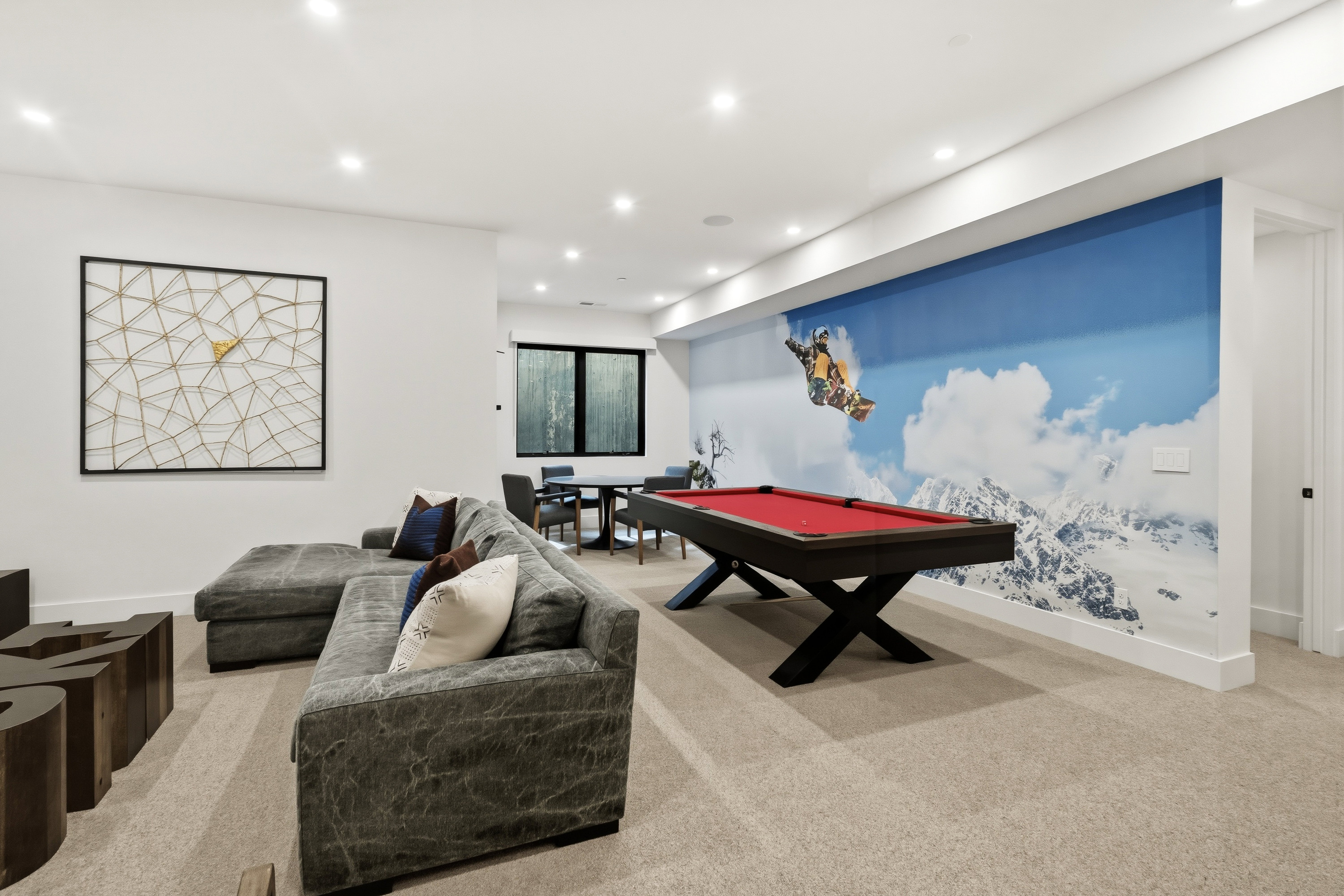 Spacious living room featuring recessed lighting, poker table, pool table, and TV area
