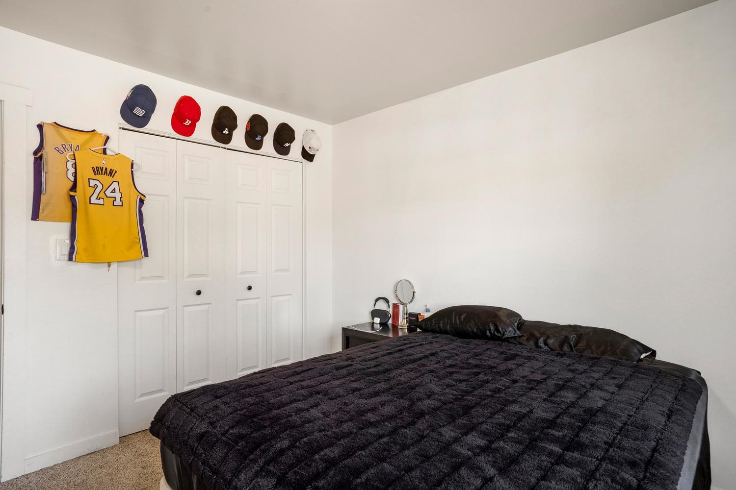 White painted walls paired with light-toned carpet flooring