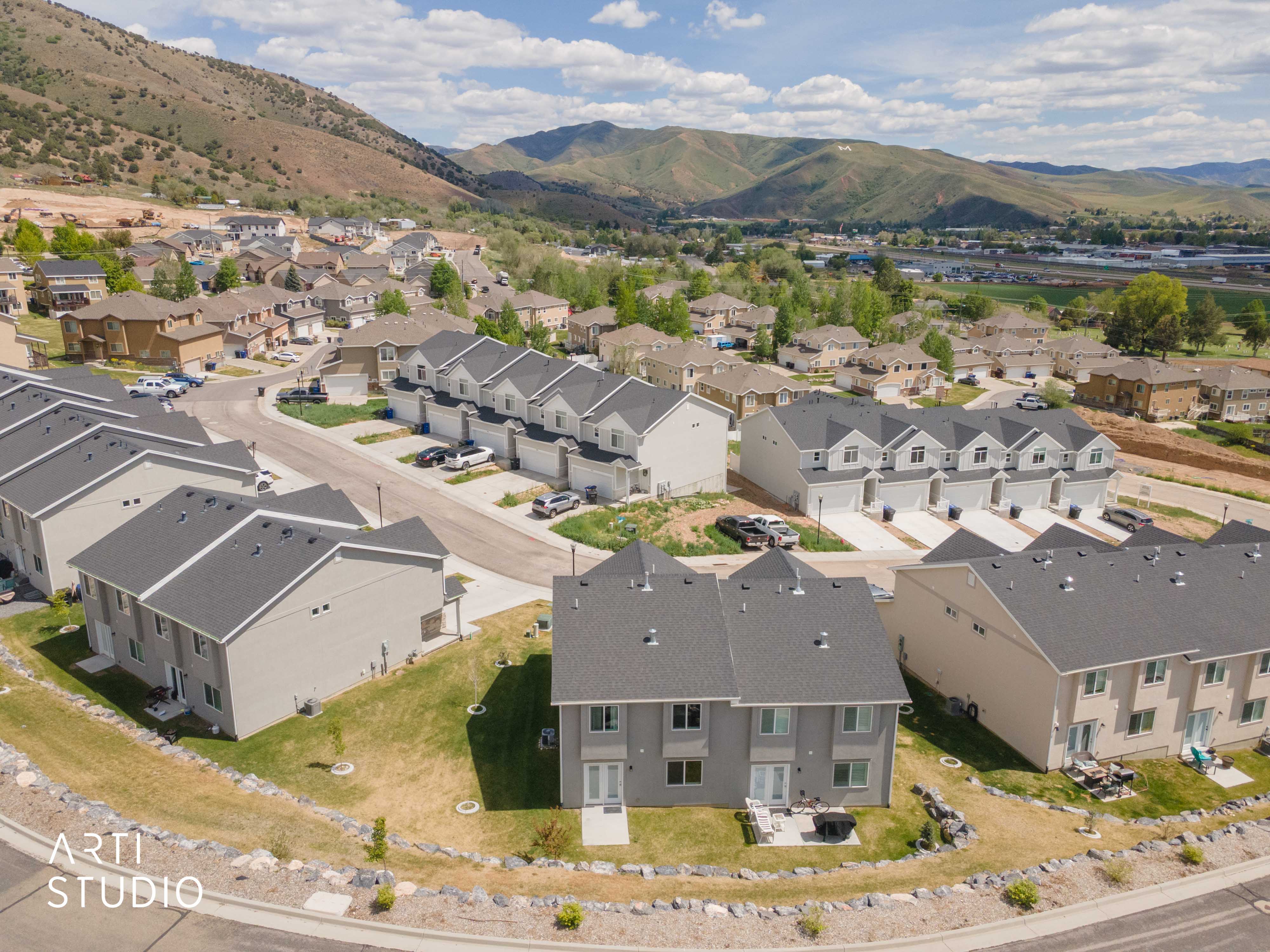 Modern residential development with a mountain backdrop