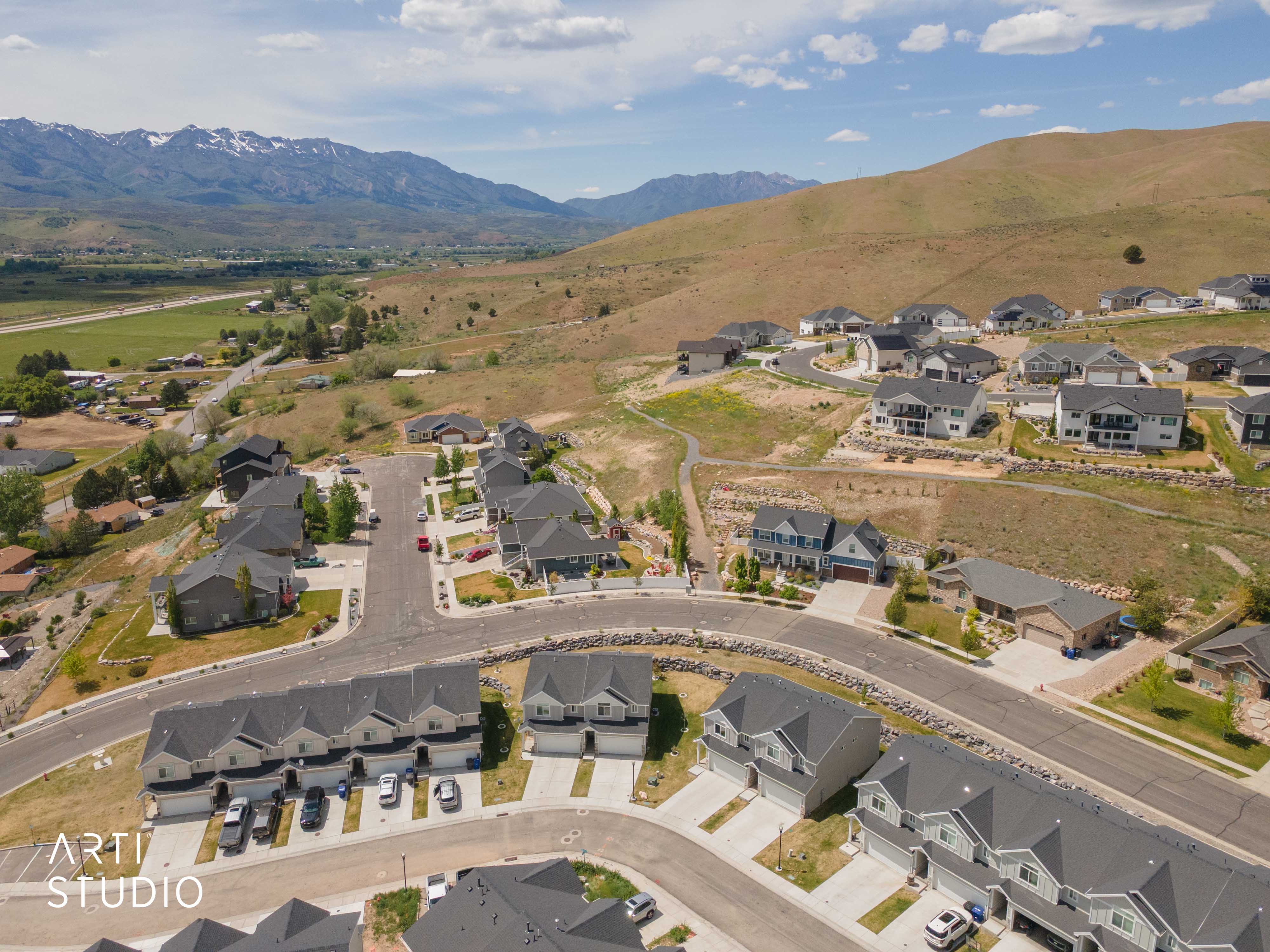 Aerial perspective highlighting a residential development with varied architectural styles