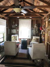 Exposed wood beam ceiling with a ceiling fan