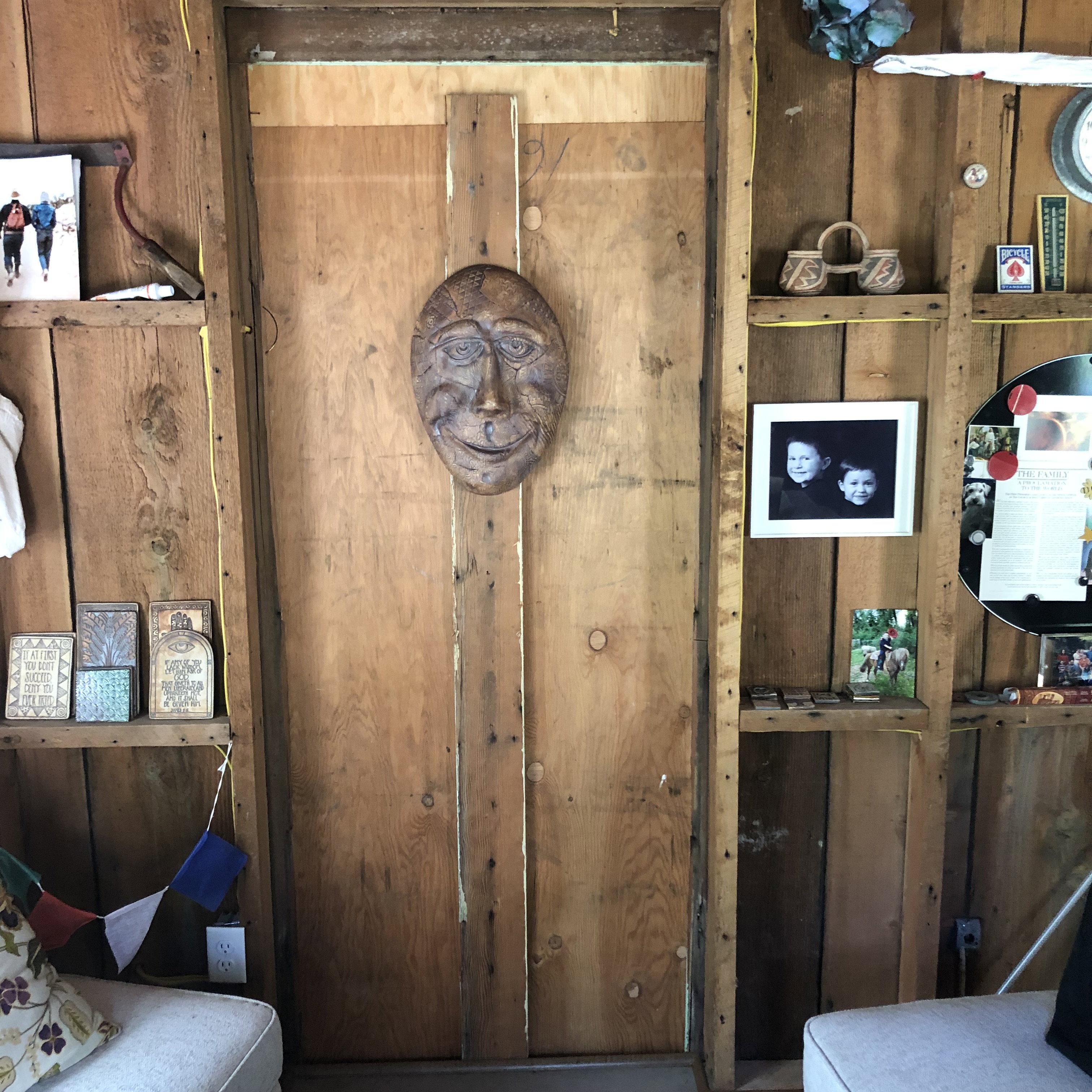 Wood-paneled interior walls featuring built-in shelving