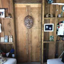 Wood-paneled interior walls featuring built-in shelving
