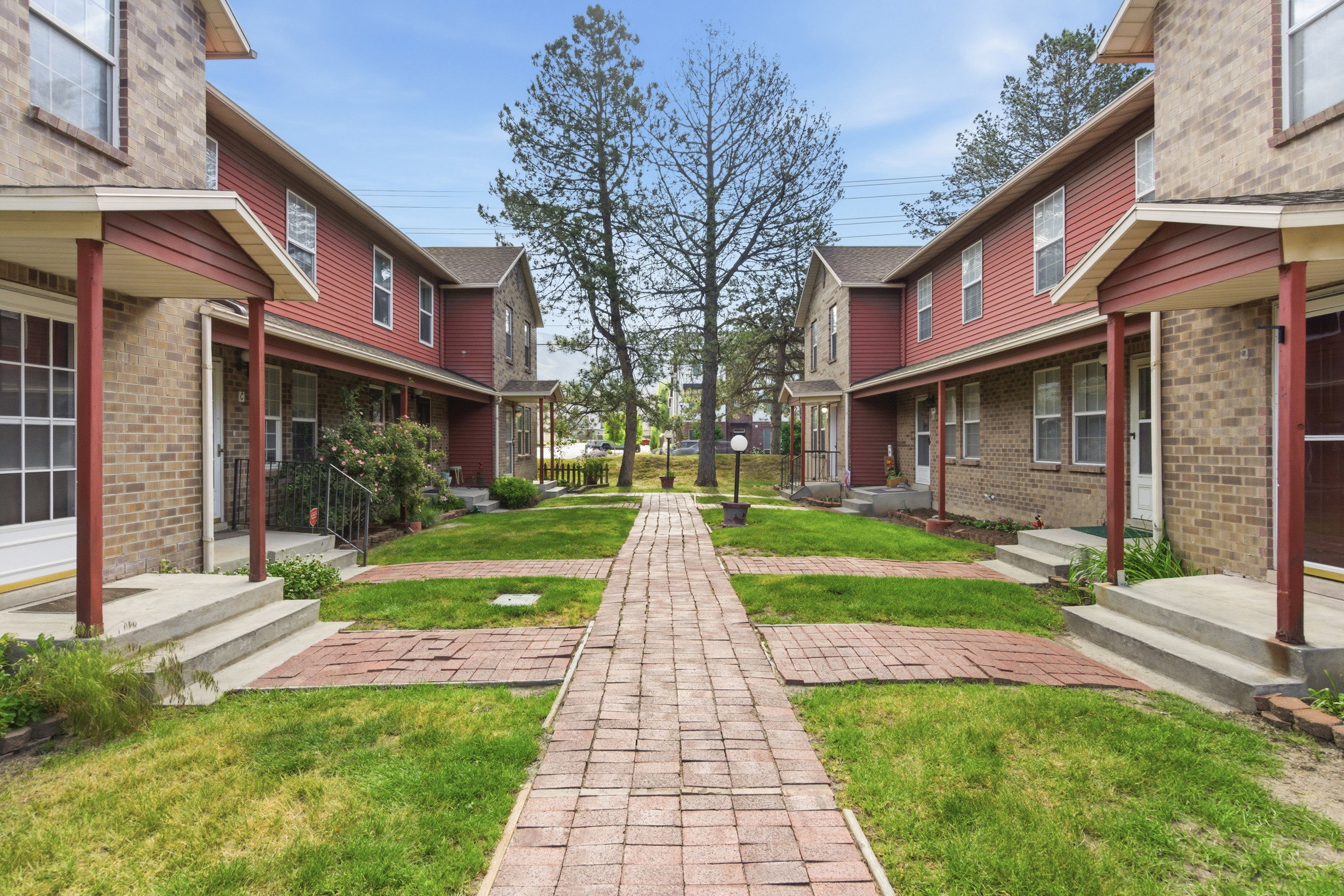 Brick and siding exteriors featuring covered entryways with support columns