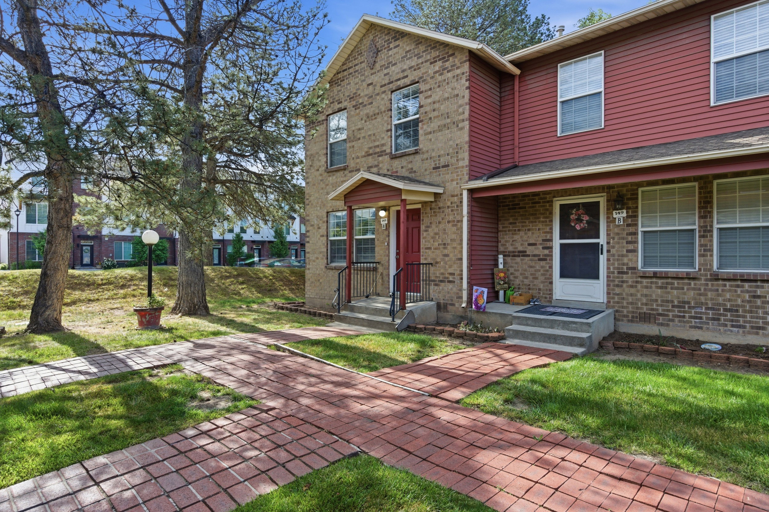 Brick and siding exterior with red accents