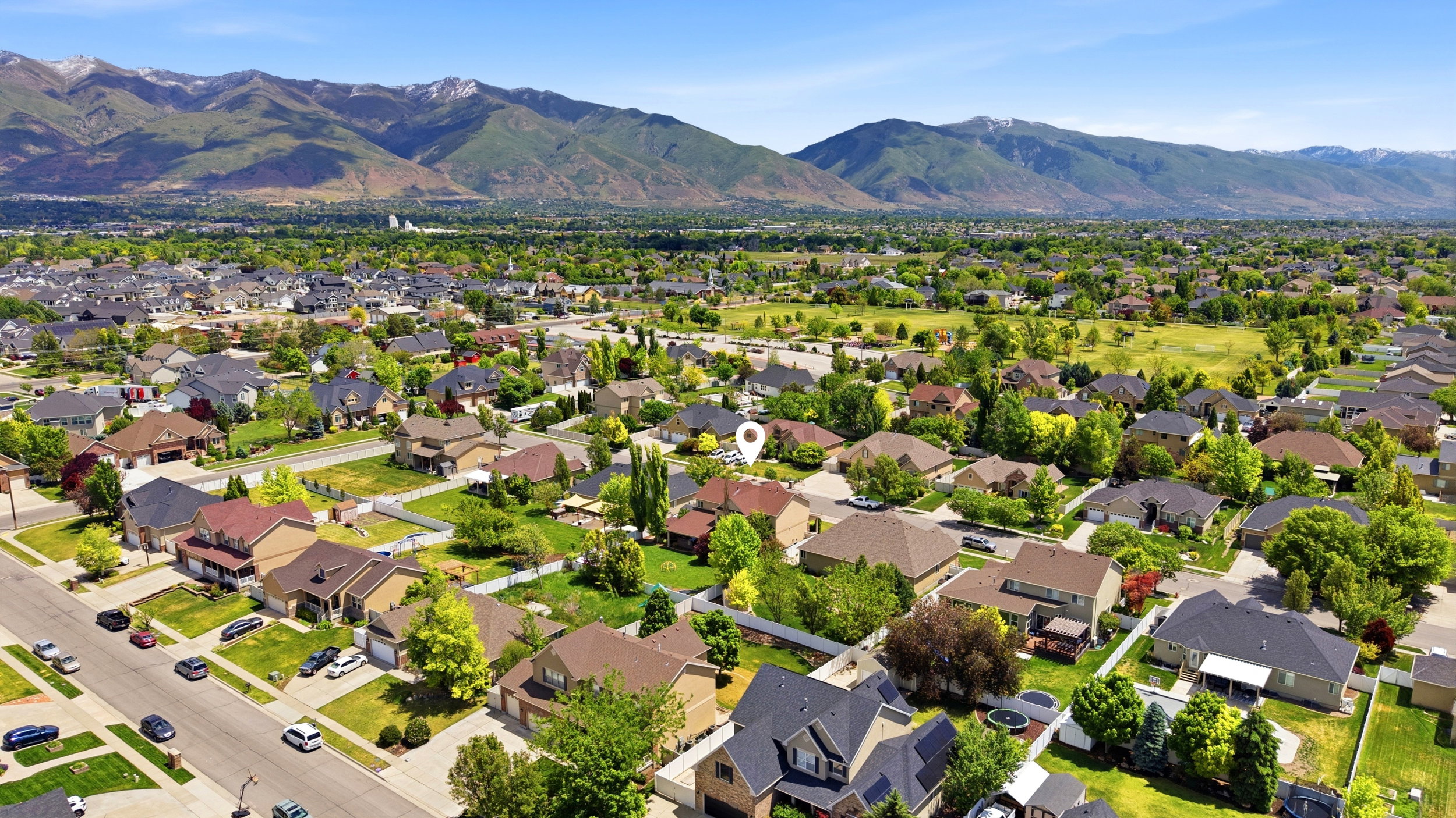 Expansive aerial perspective showcasing a residential neighborhood with diverse home styles