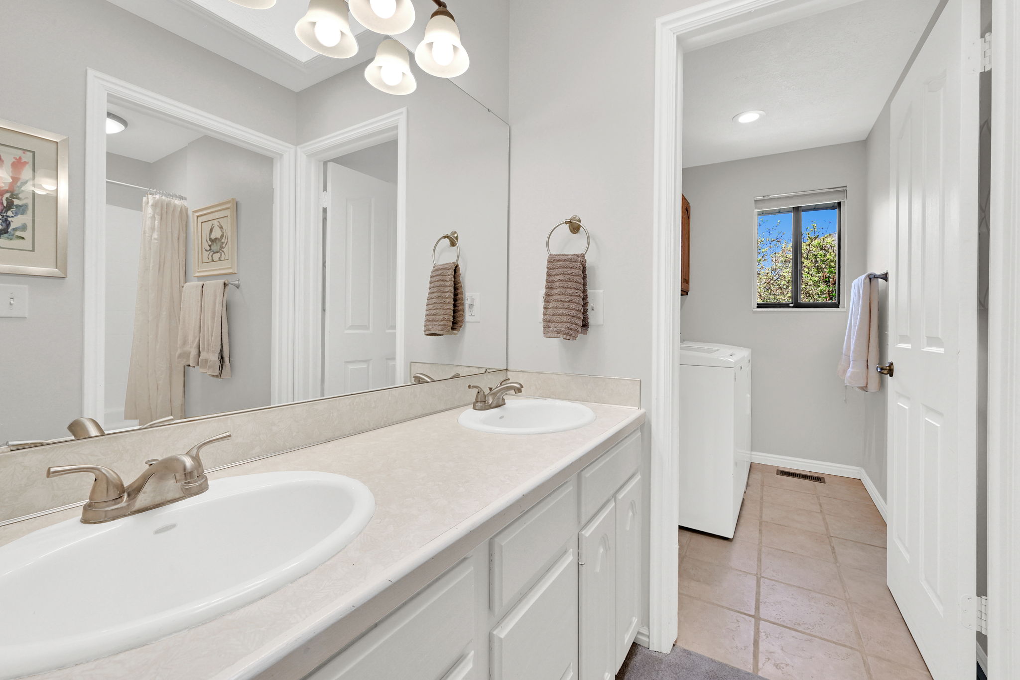 Dual vanity with undermount sinks and brushed nickel fixtures