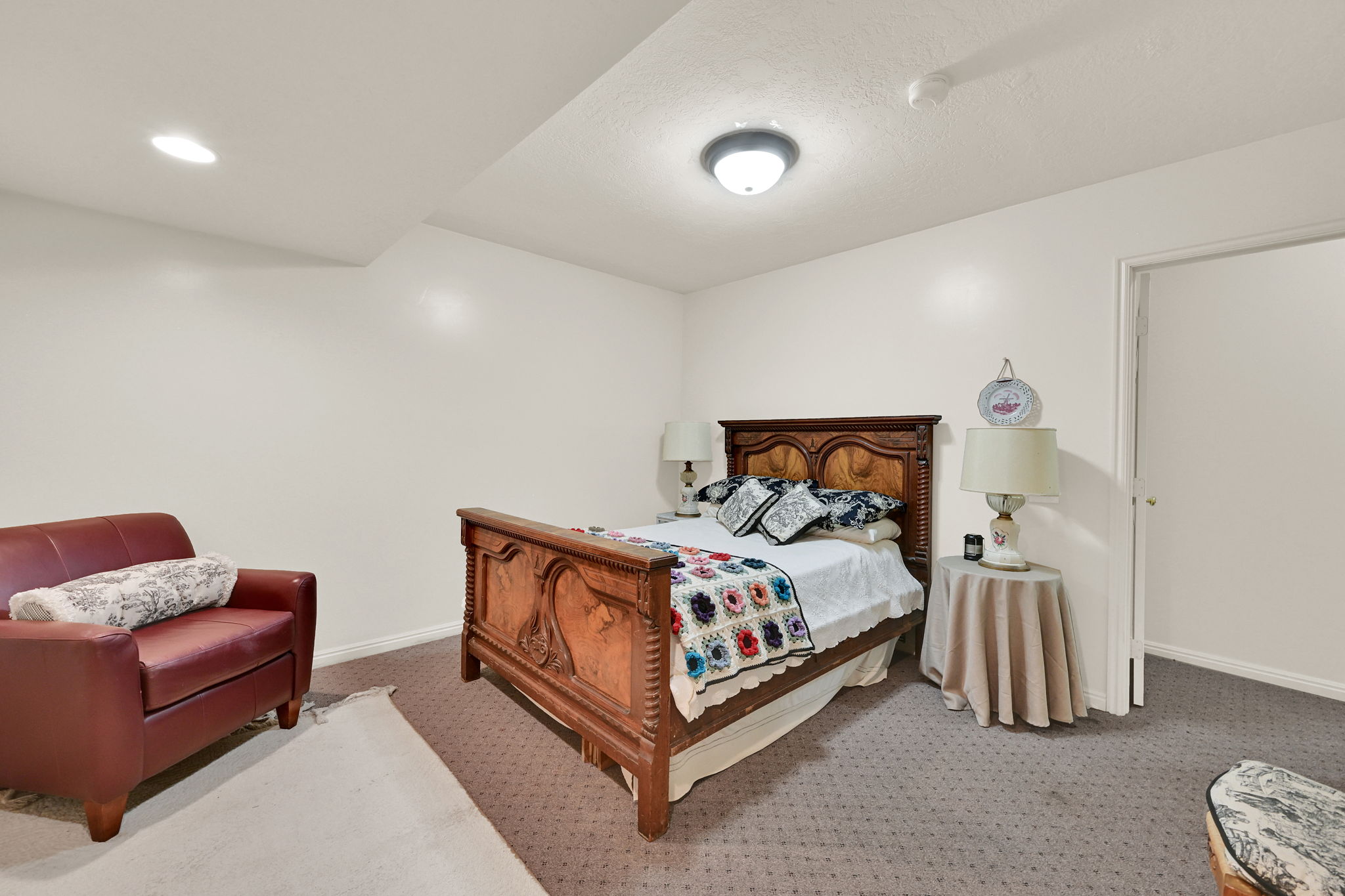 Spacious bedroom #5 featuring neutral painted walls, recessed lighting, and patterned carpeting