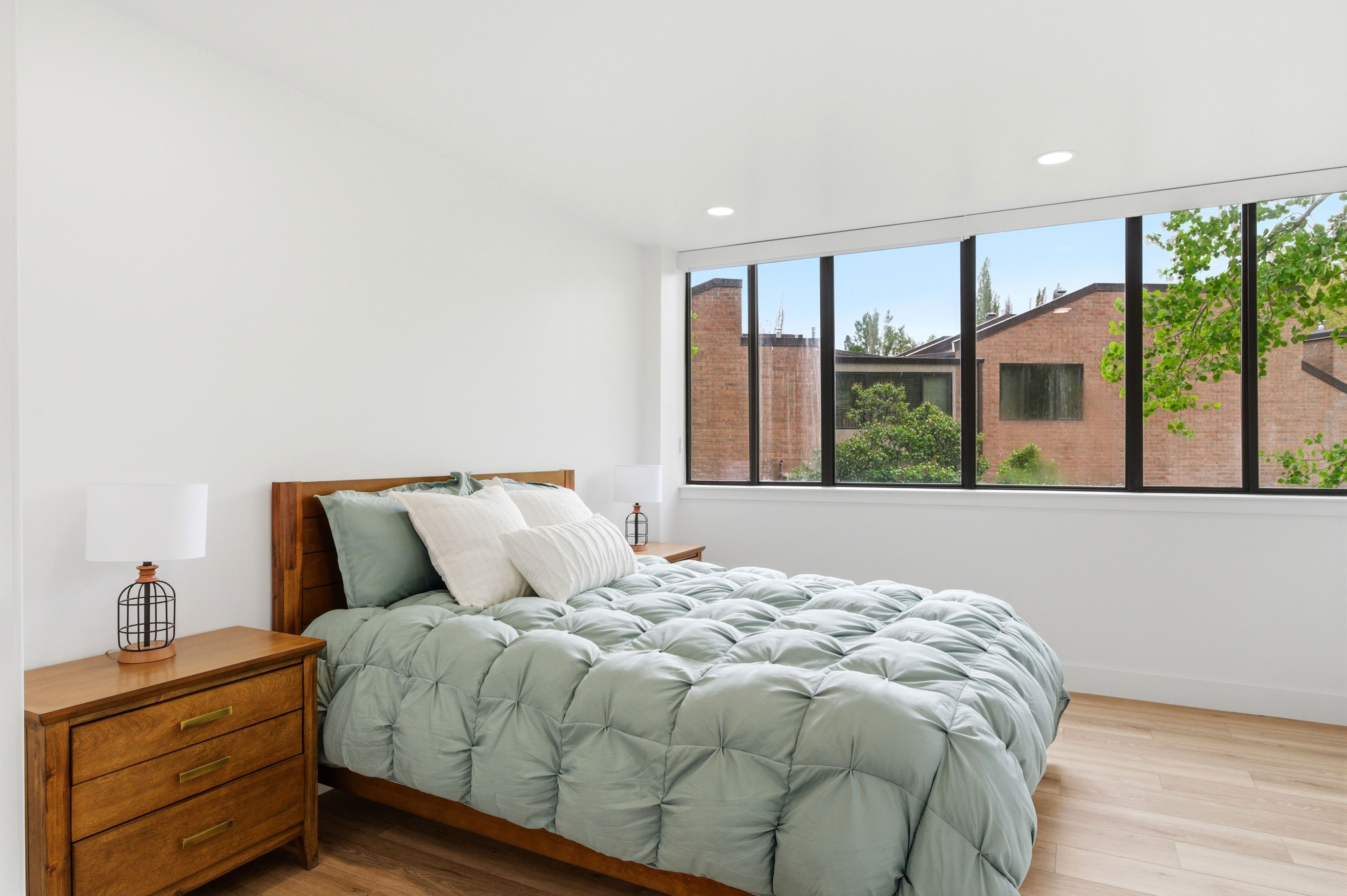 Light wood-finish flooring complements the crisp white walls