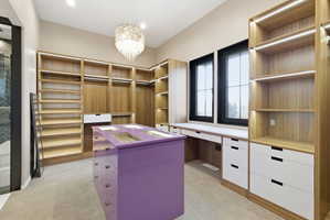 Custom closet system featuring natural wood-finish shelving and hanging rods