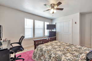 Bedroom featuring light-colored walls and carpeted flooring