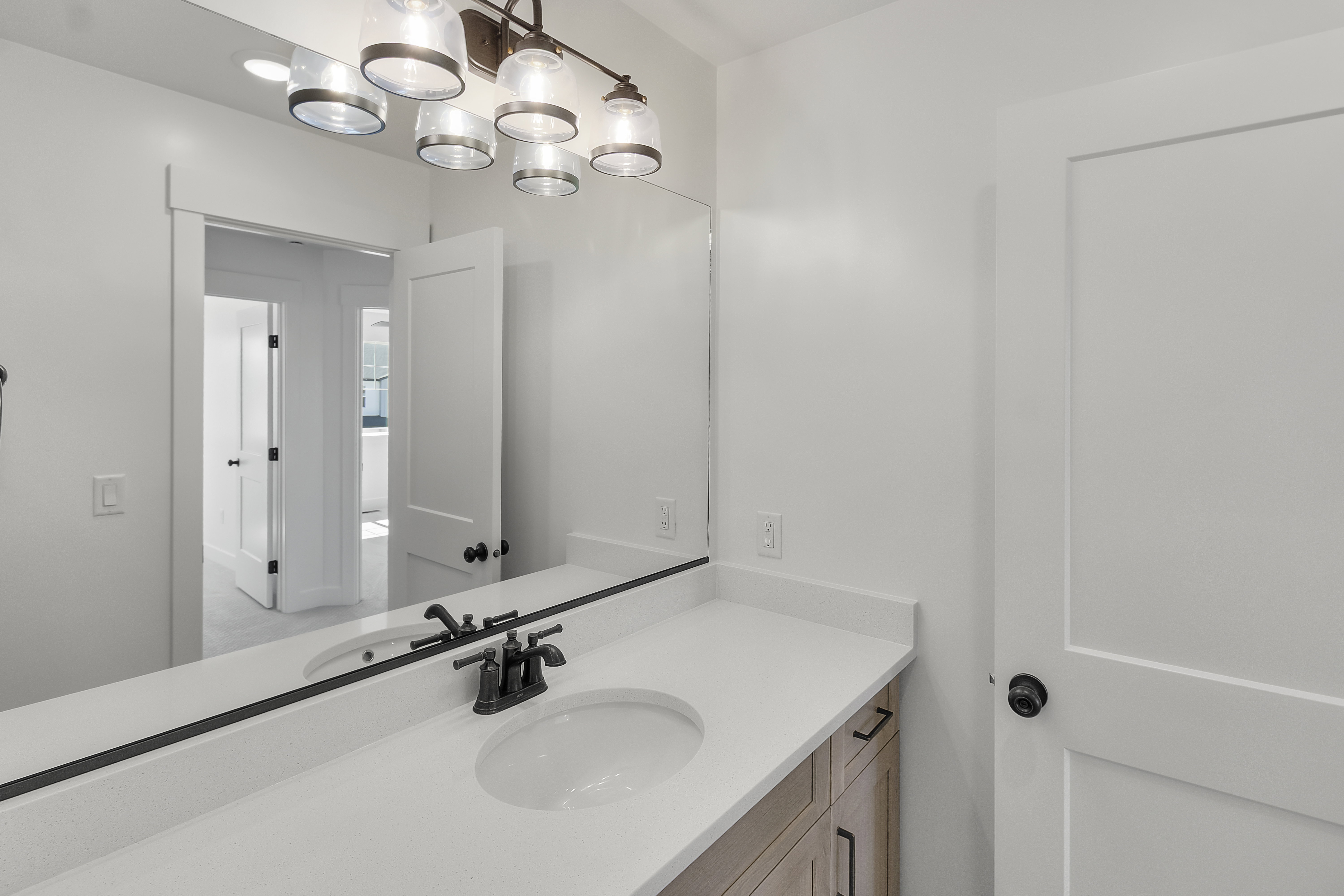 Double vanity with undermount sinks and matte black fixtures