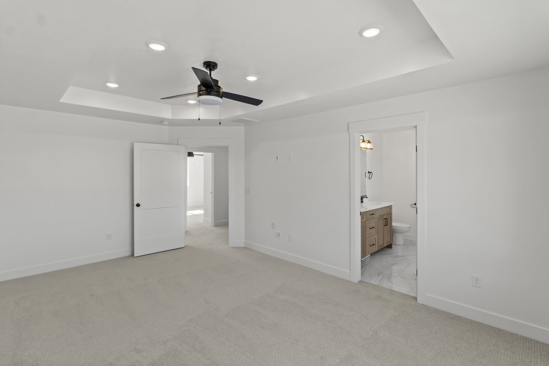 Recessed lighting in a tray ceiling with a ceiling fan