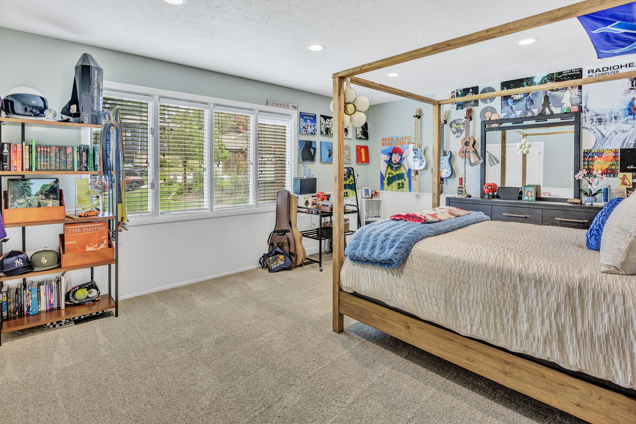 Spacious room featuring light-toned carpet flooring and a multi-panel window with white blinds