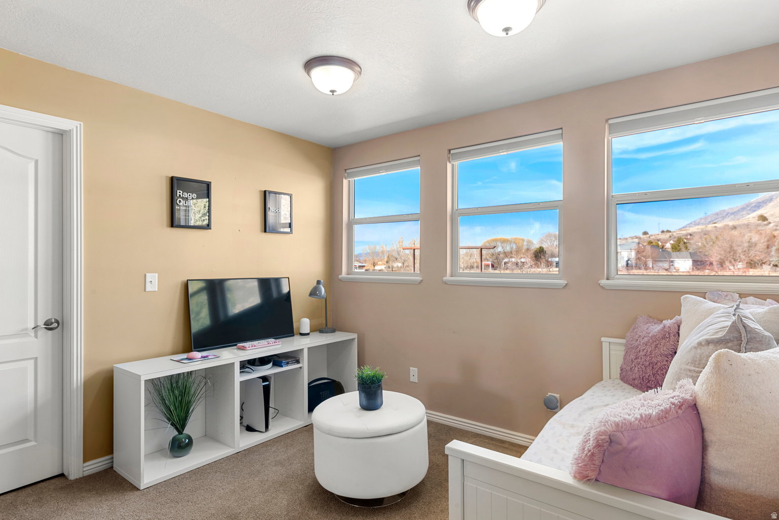 Three rectangular windows with white frames and sills