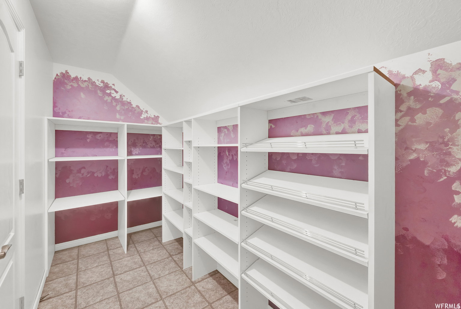 Integrated pantry shelving system featuring adjustable shelves and wire racks