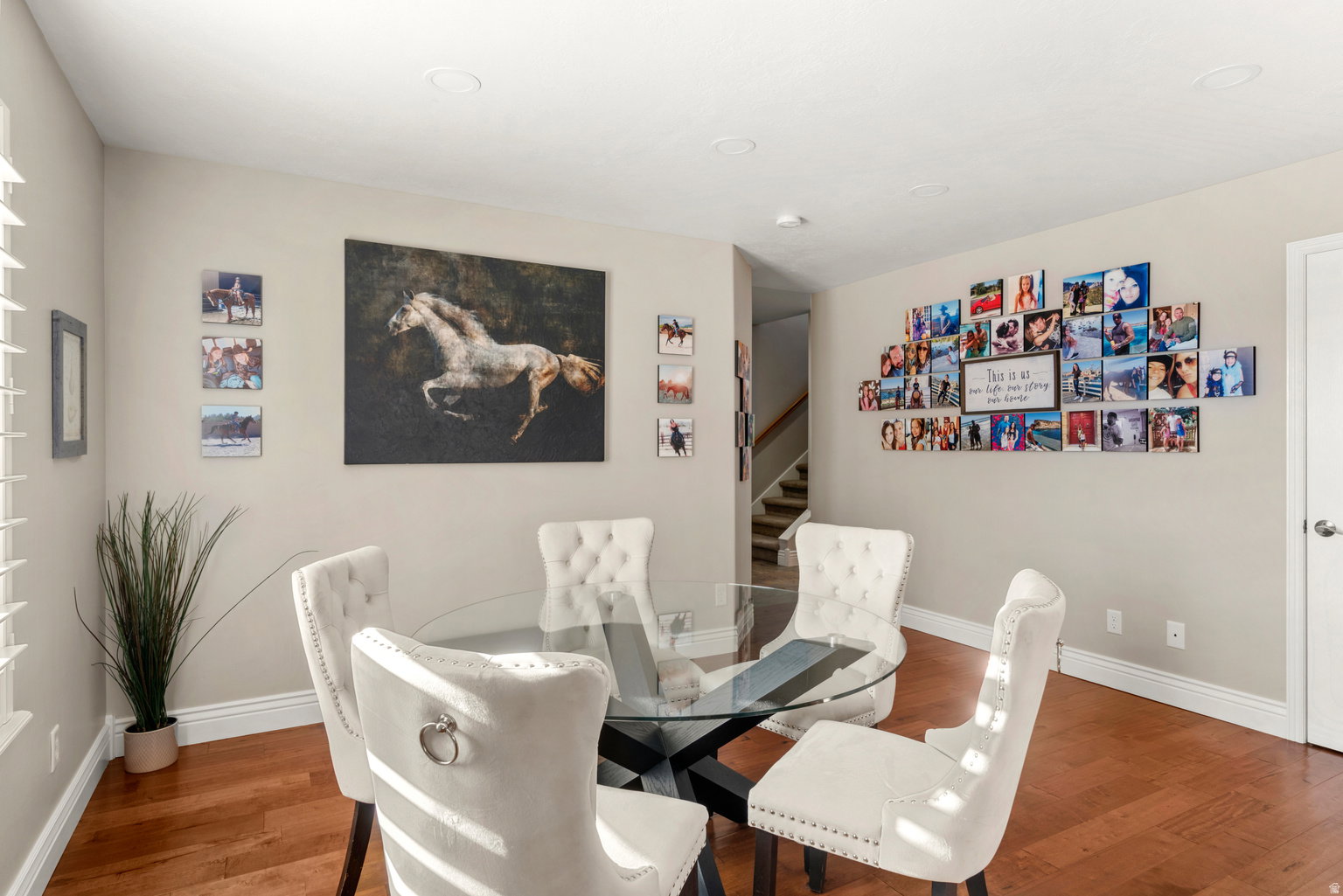 Dining space featuring wood-finish flooring, recessed lighting, and white baseboards