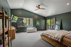 Vaulted ceilings with recessed lighting and a ceiling fan
