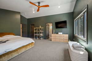 Spacious room with dark green walls and gray carpeting