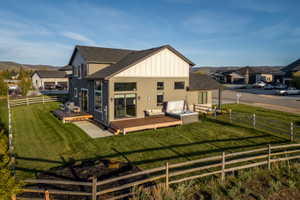 Contemporary multi-story residence with a dark roof and light siding accents