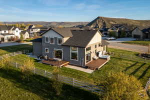Contemporary home with gray siding and white trim