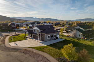 Modern farmhouse-style residence with a two-car garage and an additional single-car garage