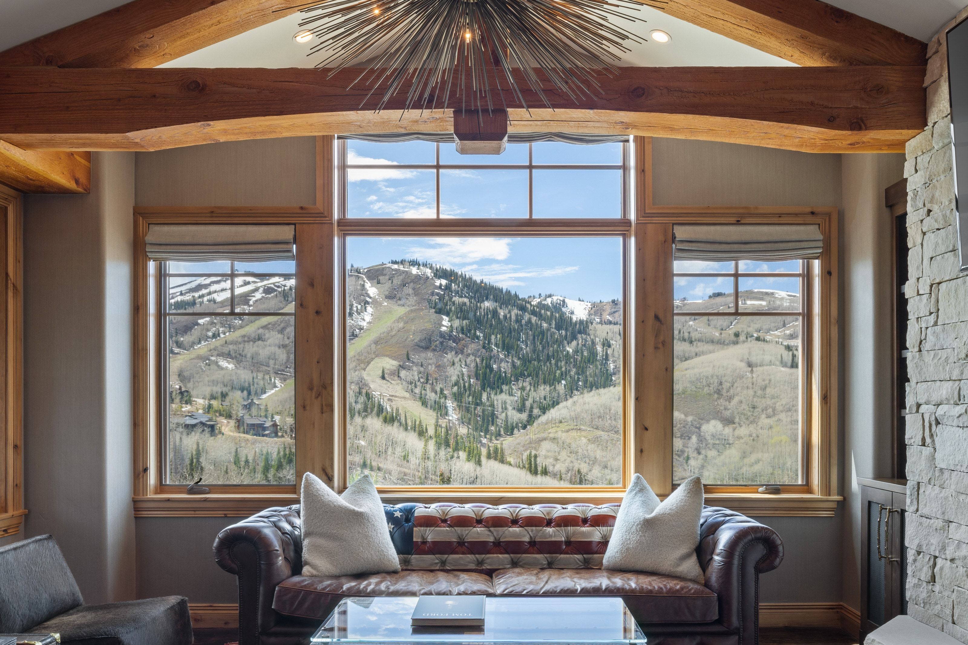 Expansive window wall offering mountain scenery