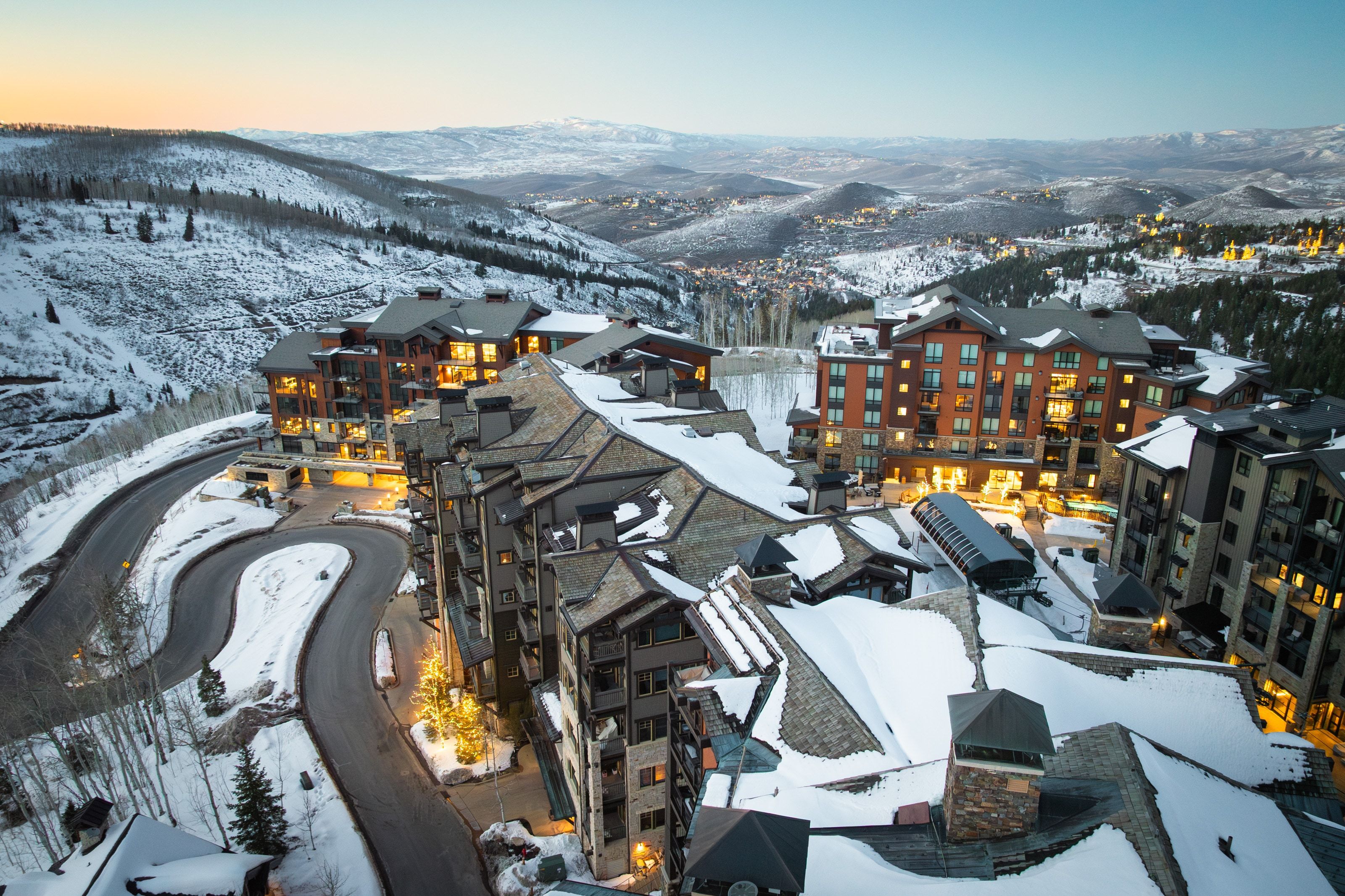 Luxurious multi-story buildings featuring stone and wood-finish exteriors