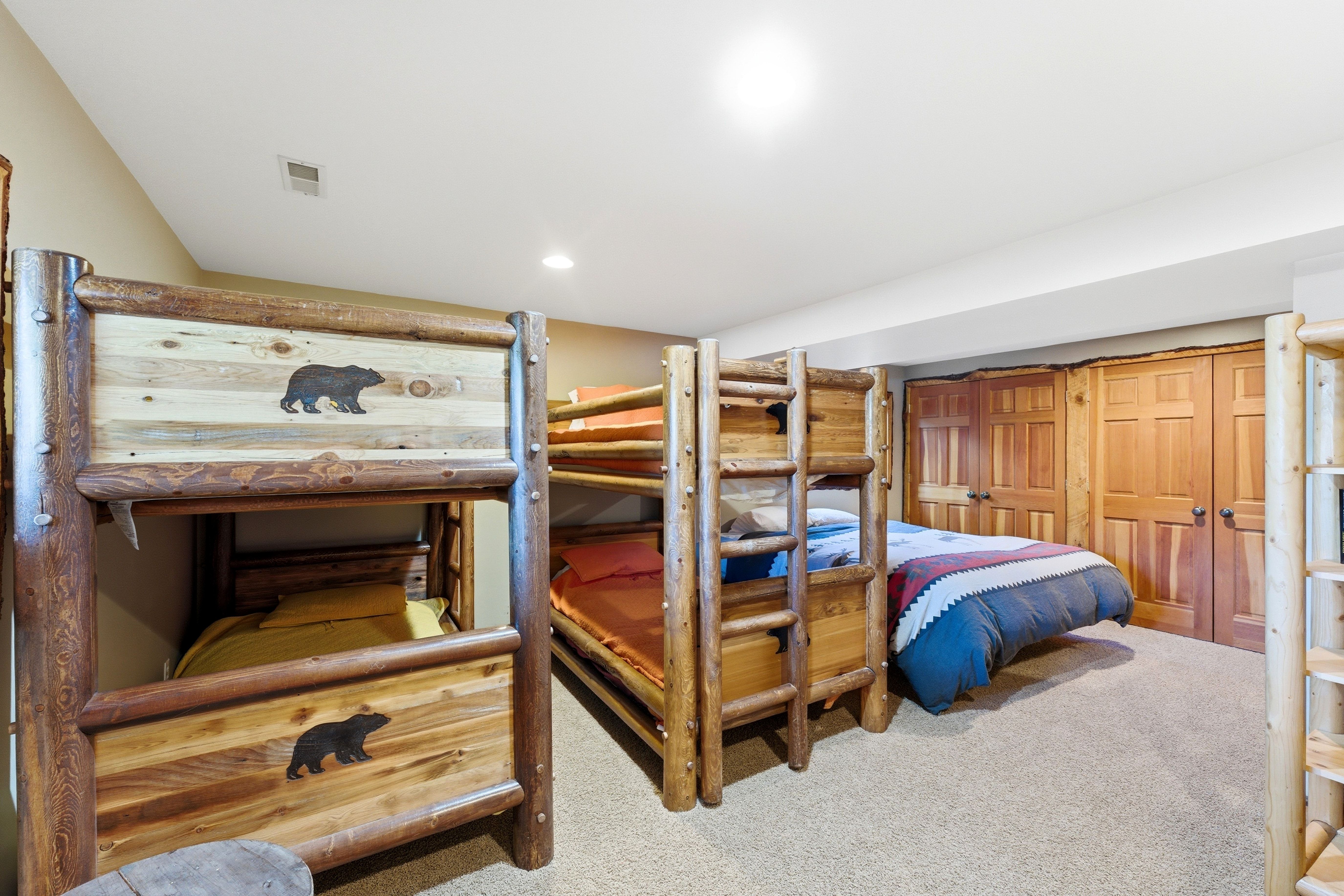 Room with light beige carpeting and recessed lighting