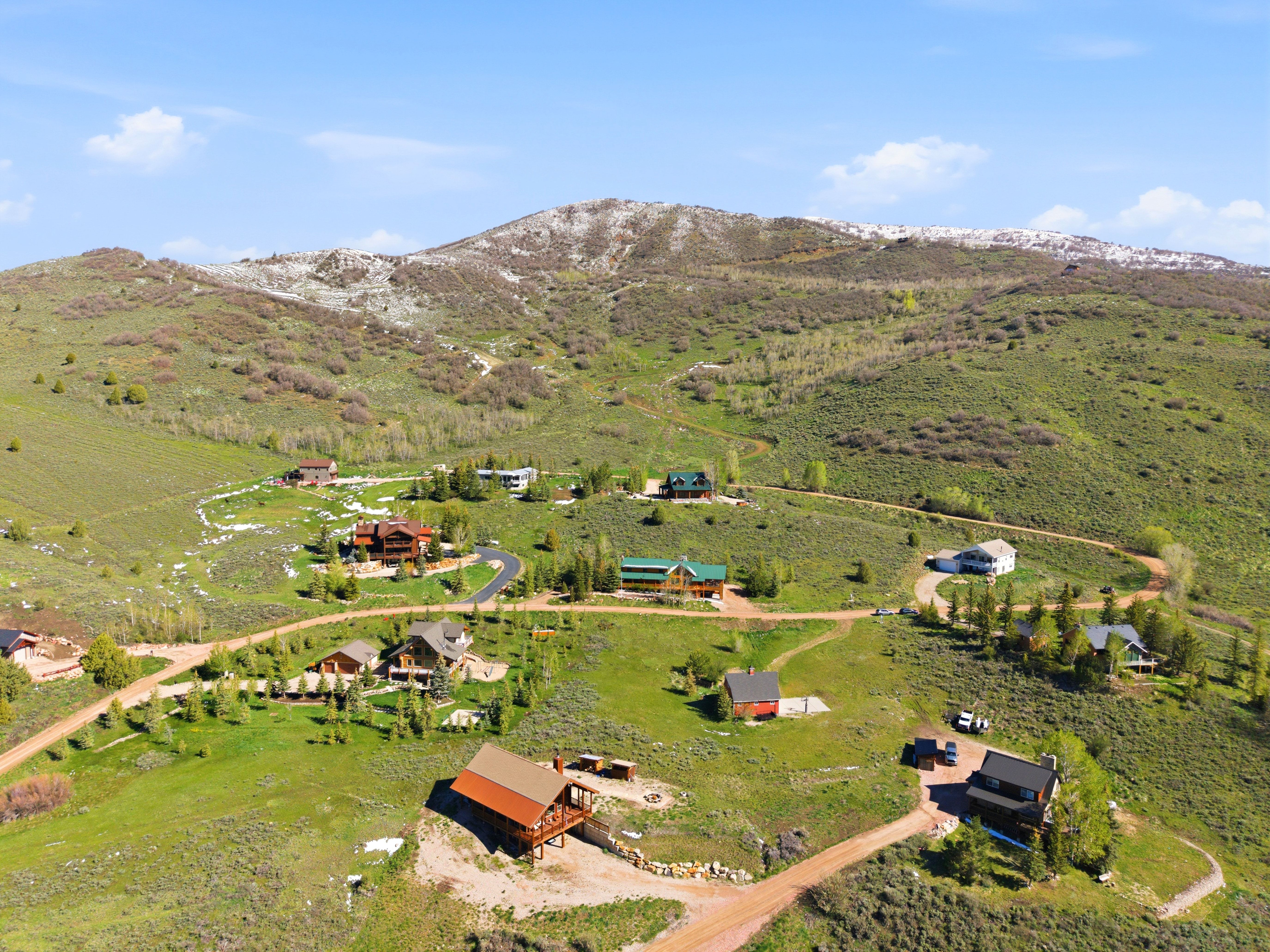 Mountainous terrain with scattered residential properties
