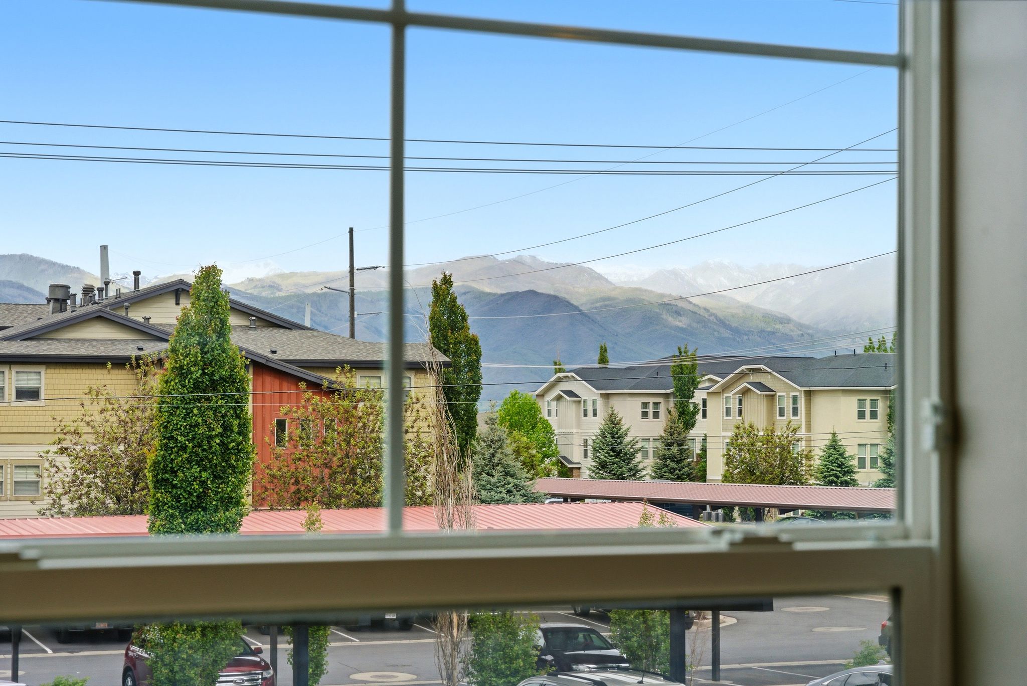White framed window overlooking distant mountains
