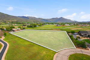 Expansive residential lot featuring a level, grass-covered terrain