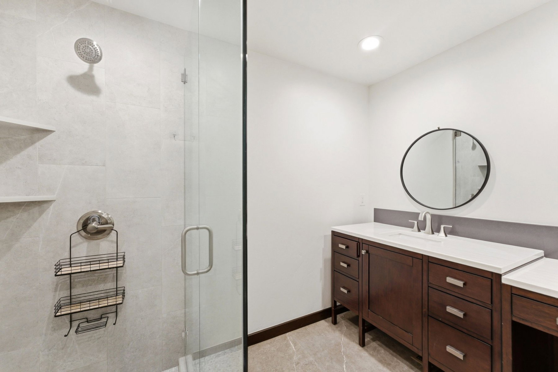 Shower with full-height tile surround and built-in shelving
