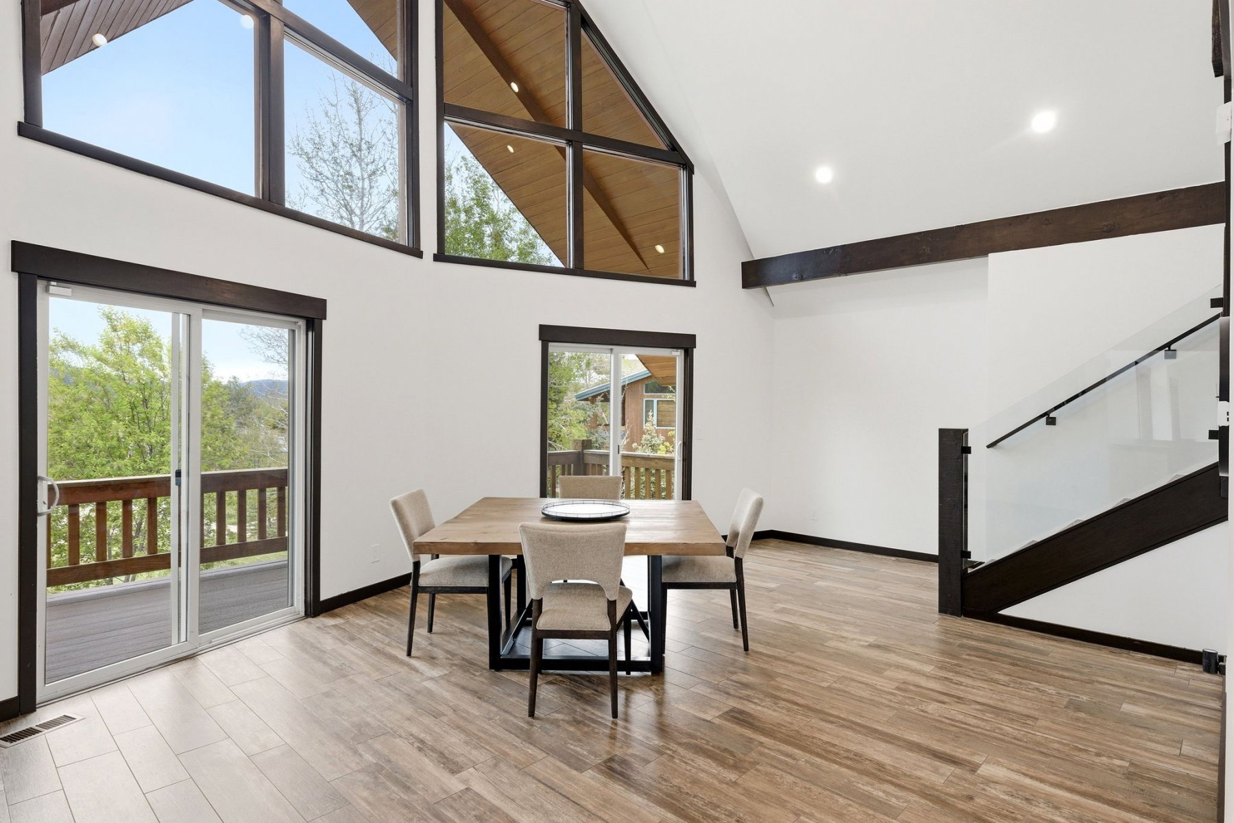 Vaulted ceilings with exposed beams and recessed lighting