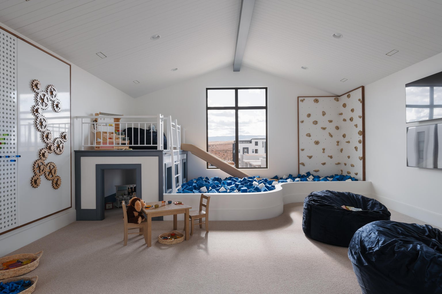 Versatile bonus room featuring a built-in play structure with a slide, a recessed pit, a climbing wall, and recessed lighting