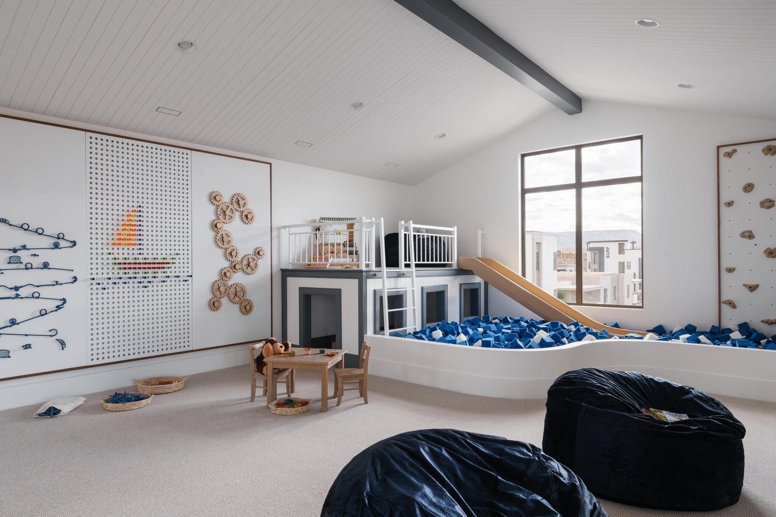 Spacious bonus room featuring a vaulted ceiling with exposed beam, recessed lighting, large multi-pane window, and light-toned carpeting