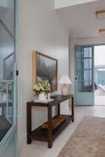 Light-toned wall finishes complemented by white baseboards and light flooring