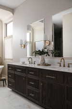 Double vanity with dark wood-finish cabinetry, white countertop, and dual undermount sinks
