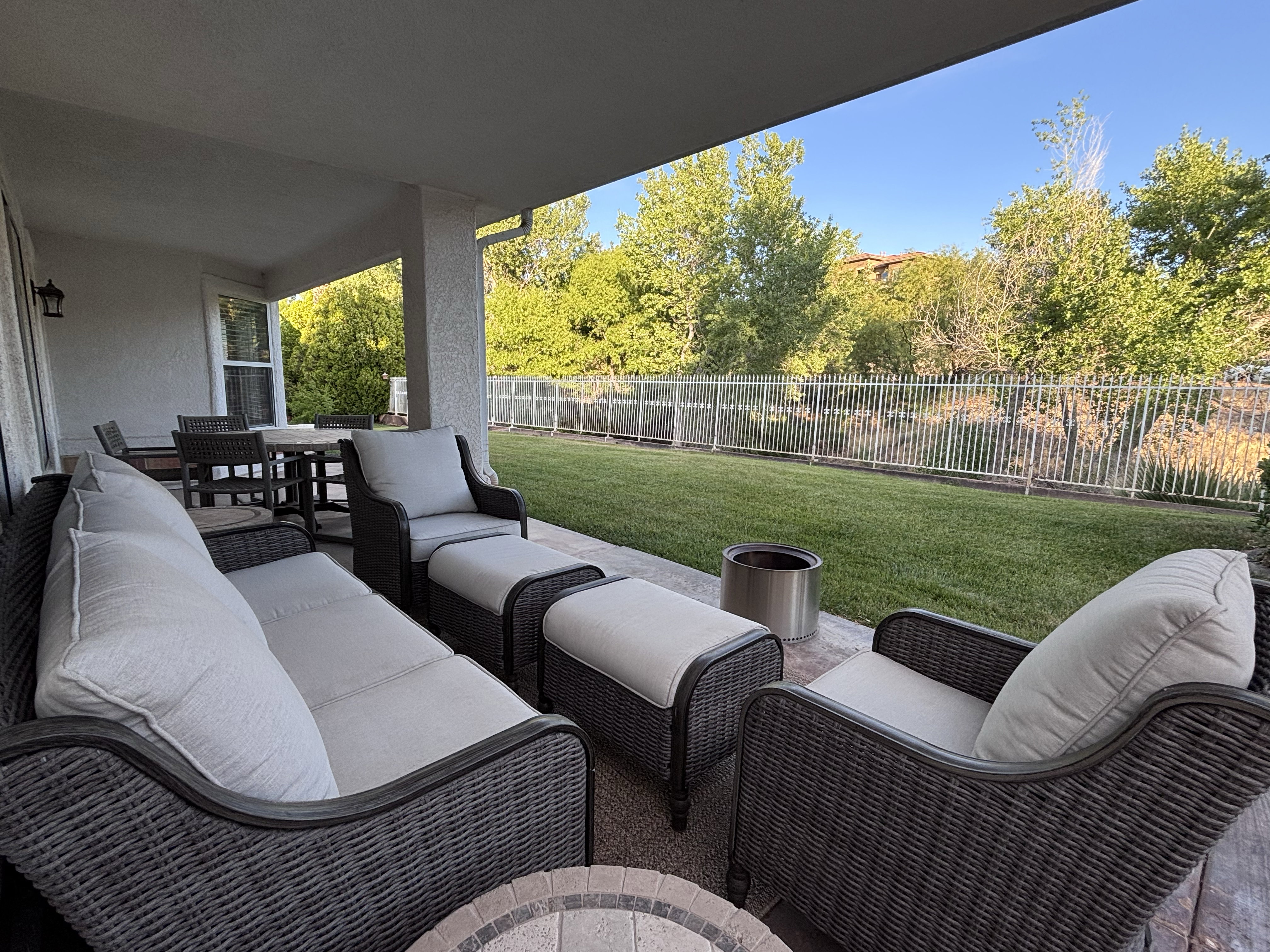 Covered patio space featuring a concrete slab floor