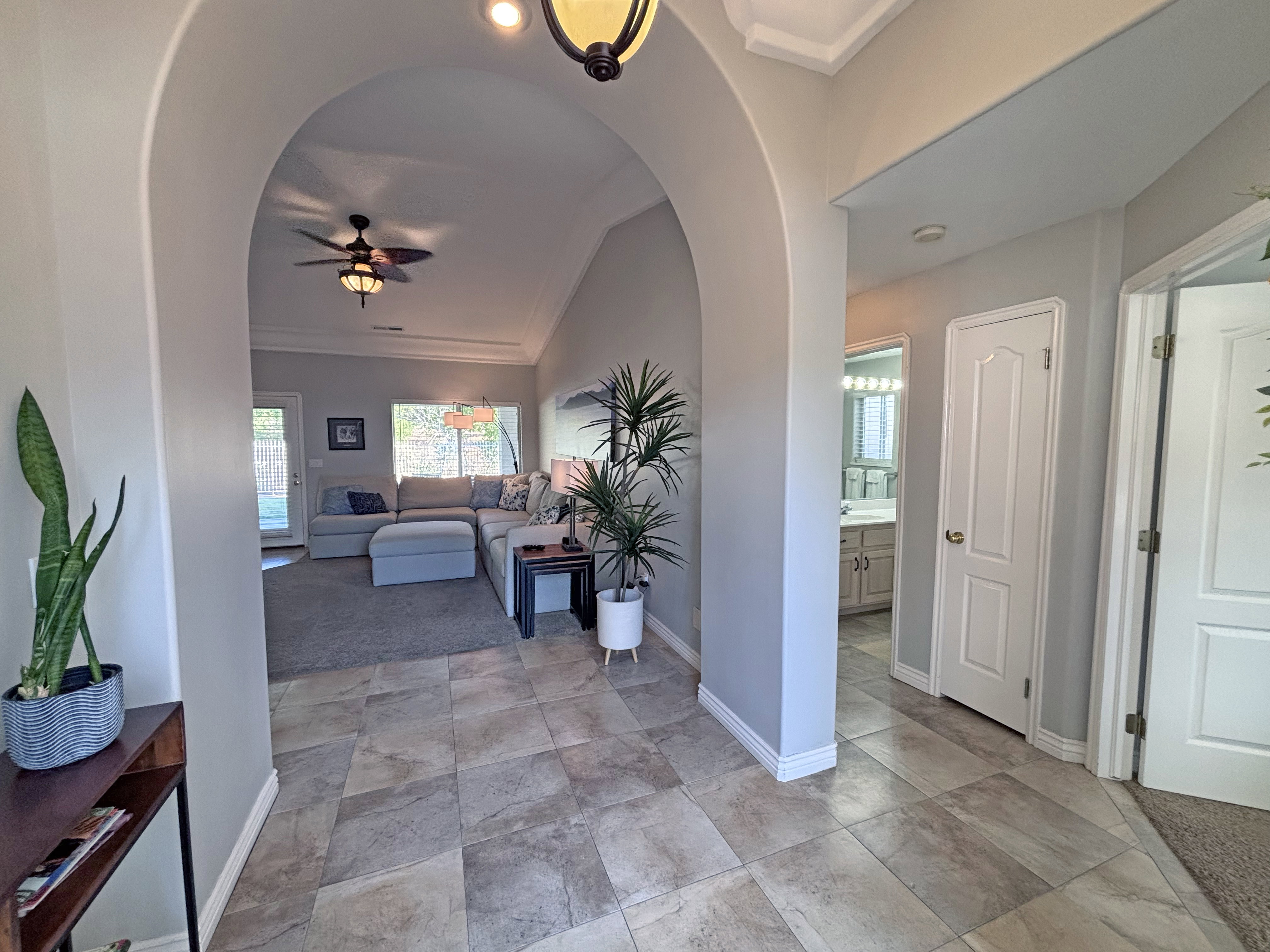 Entry foyer with large format stone-look tile flooring