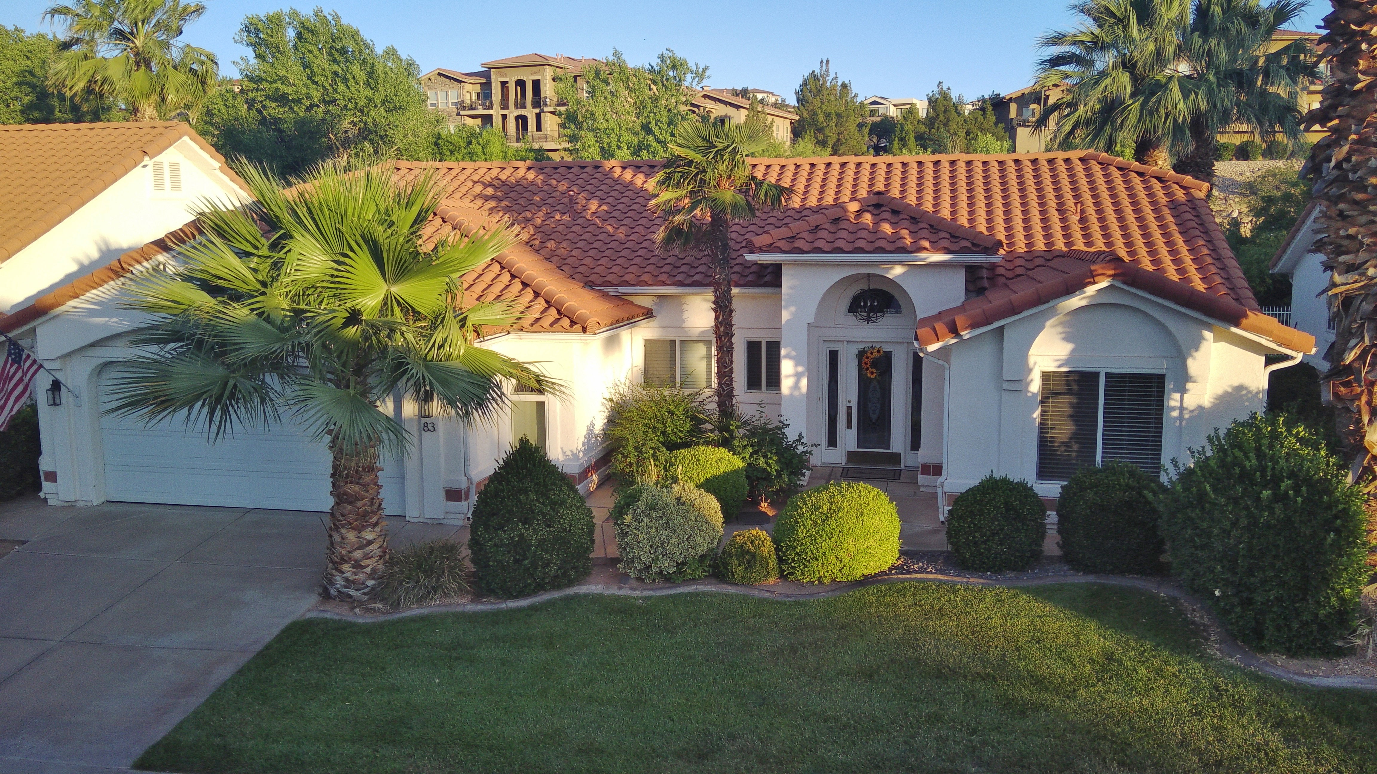 Mediterranean-style residence featuring a terracotta tile roof and stucco exterior